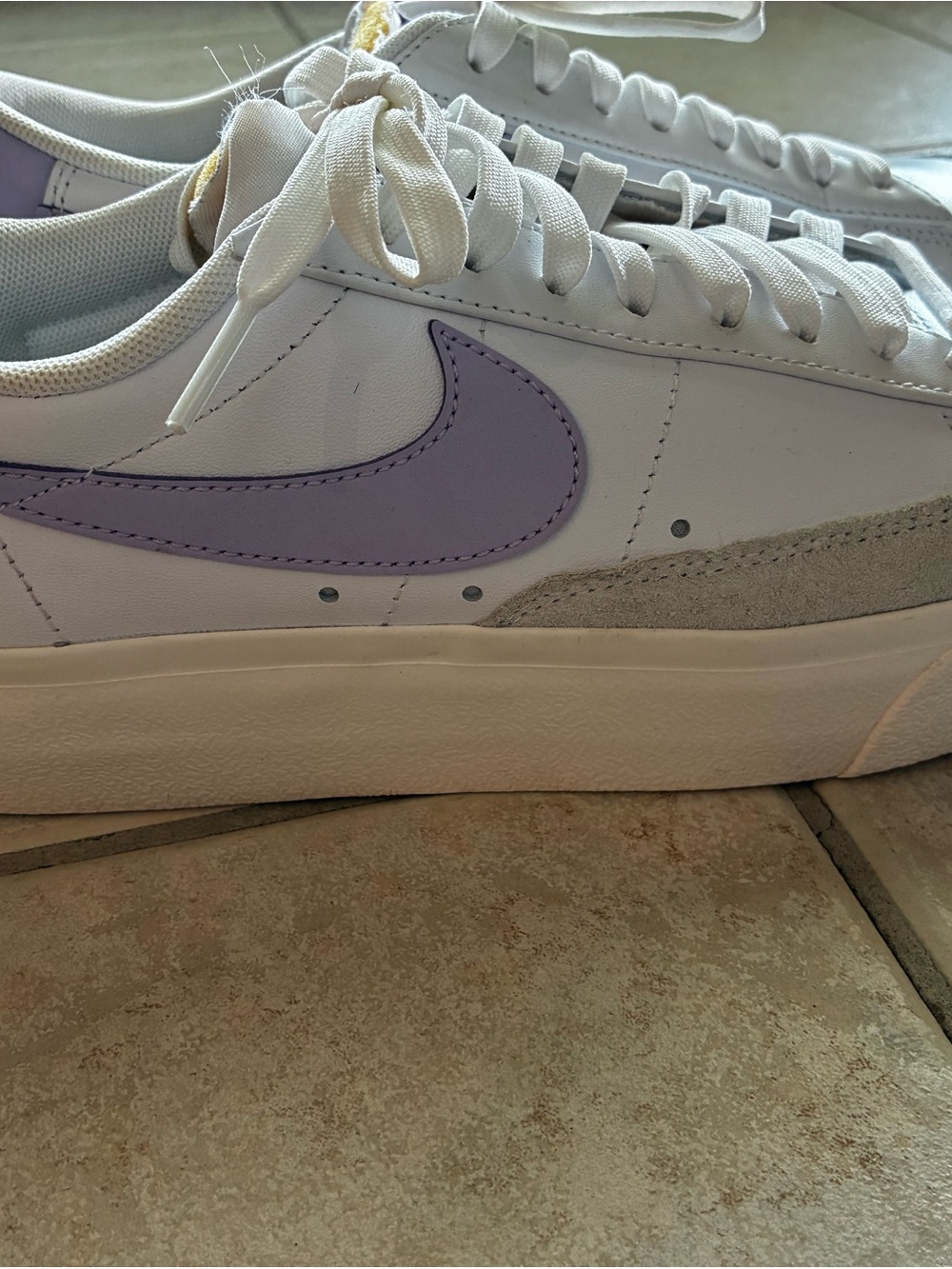 Nike woman’s White Sneaker with Lilac Swoosh